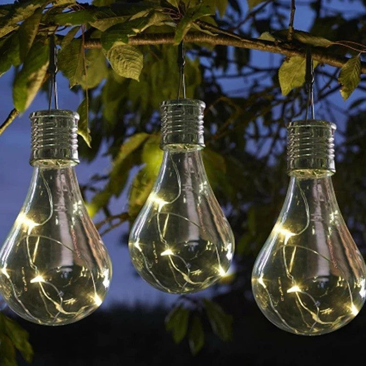 Lampa Solara LED Decorativă sub forma de Bulb, pentru exterior , suspendata, IP65, Bulb transparent , Lumina caldă